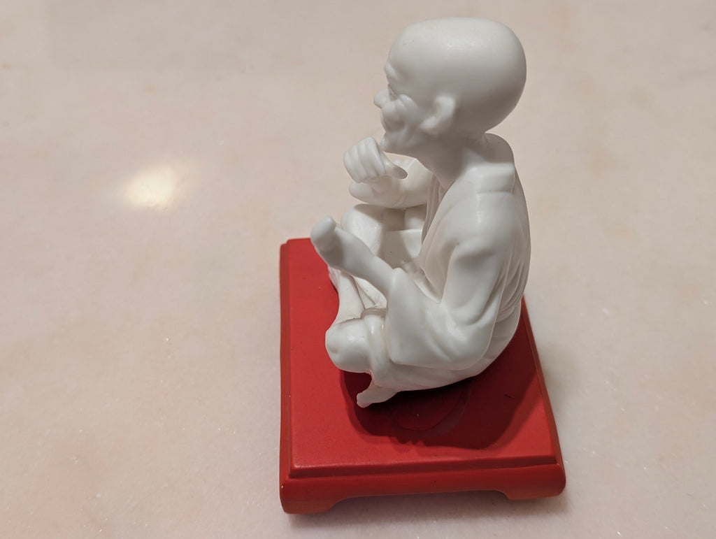 Chinese Bisque Porcelain Scholar Figurine on Red Display Stand – Blanc de Chine Style