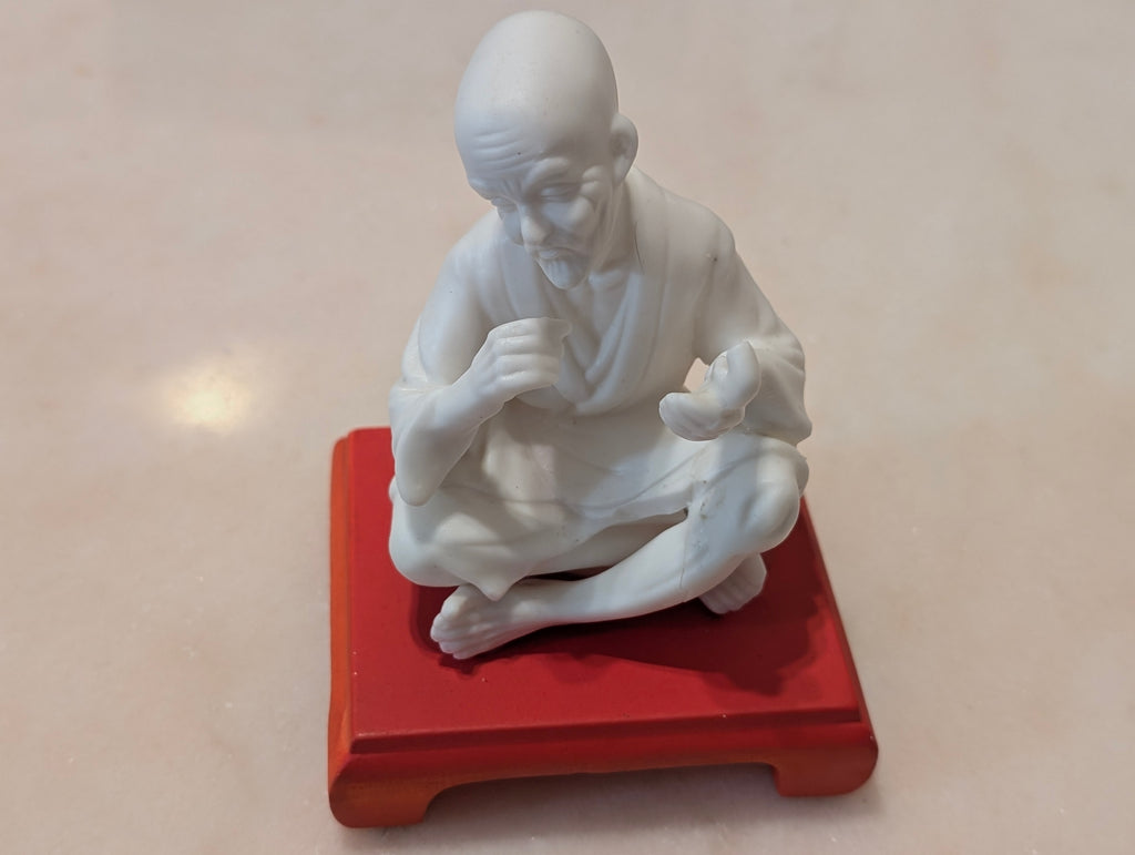 Chinese Bisque Porcelain Scholar Figurine on Red Display Stand – Blanc de Chine Style