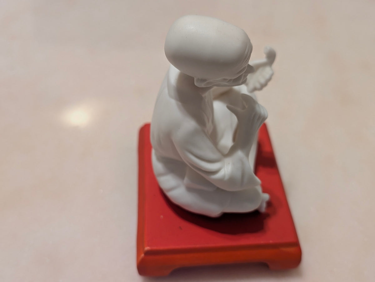 Chinese Bisque Porcelain Scholar Figurine on Red Display Stand – Blanc de Chine Style